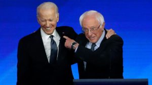 Joe Biden, Bernie Sanders spar over long records on trade, entitlements, guns and Iraq as primaries push on